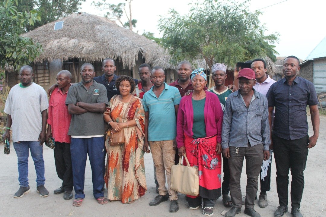 Community gathering during outreach in Ruaruke Village