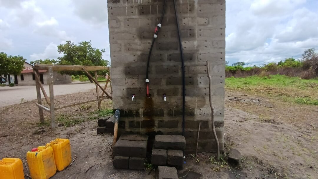 Water point construction with pipework and jerry cans
