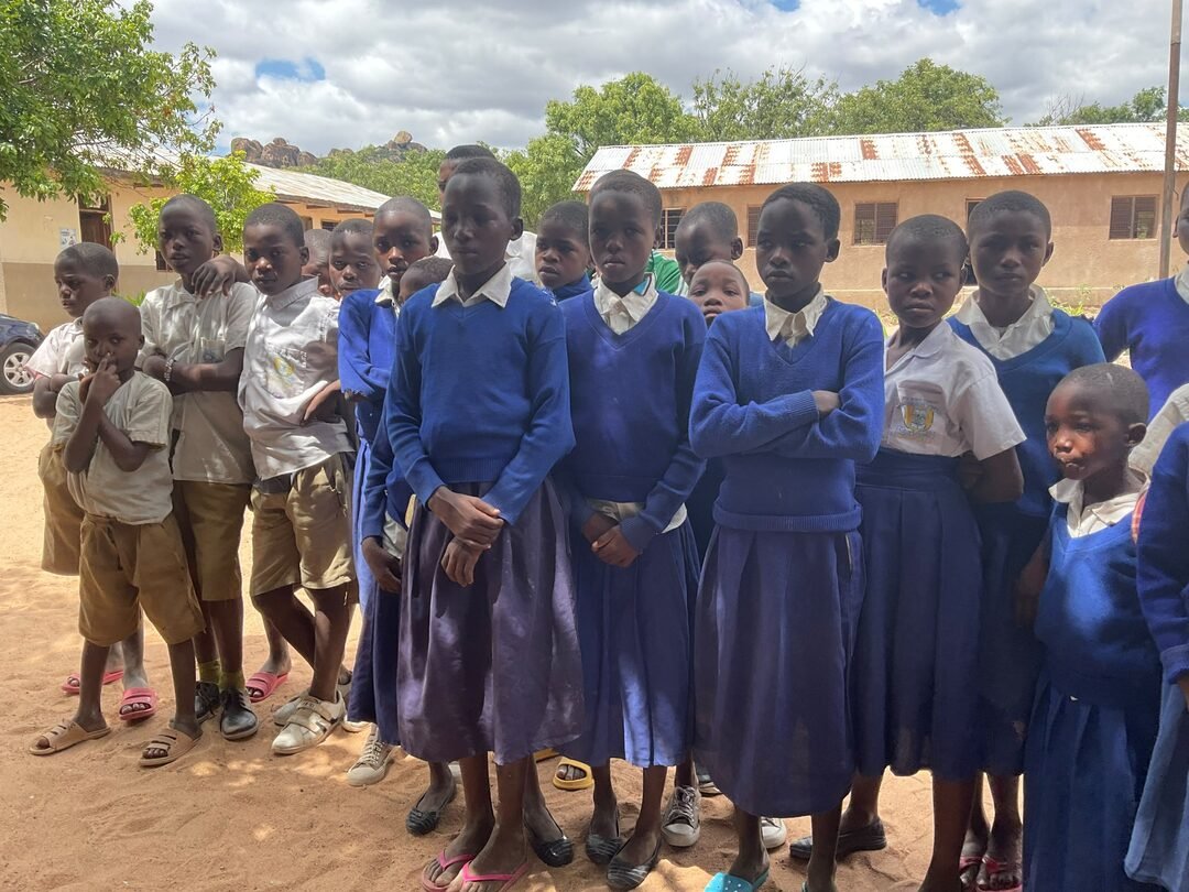 Schoolchildren in uniform standing together