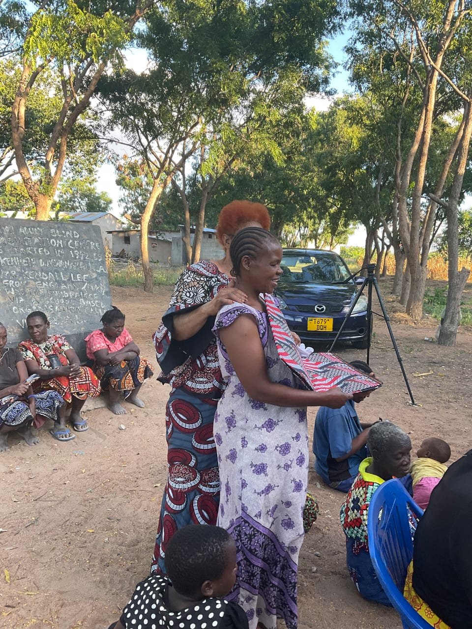 Foundation leader greeting community member